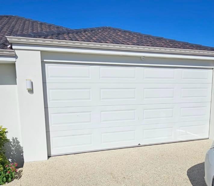 Garage door after professional repair - fully functional and safe